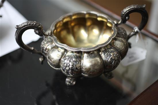 A William IV silver melon shaped two handled sugar bowl and matching cream jug, 20.5 oz.